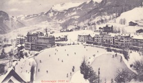 Winter vista of Grindelwald featuring snowy landscapes and historic hotels, capturing a serene, nostalgic mood ideal for travel and history enthusiasts.