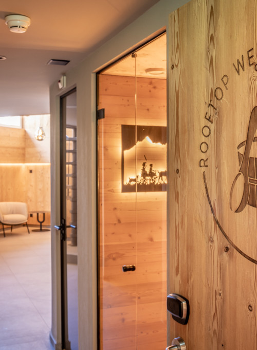 Warm wooden interiors and subtle lighting in a wellness spa entrance, creating a serene and welcoming atmosphere for relaxation.