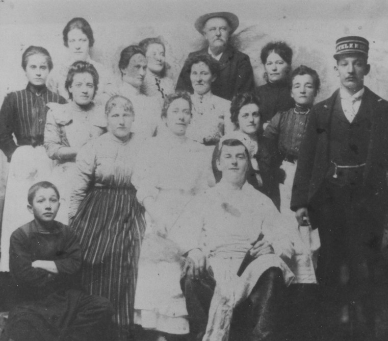 Vintage black and white group portrait, reflecting historic cultural attire and solemn unity, ideal for historical or genealogical studies.