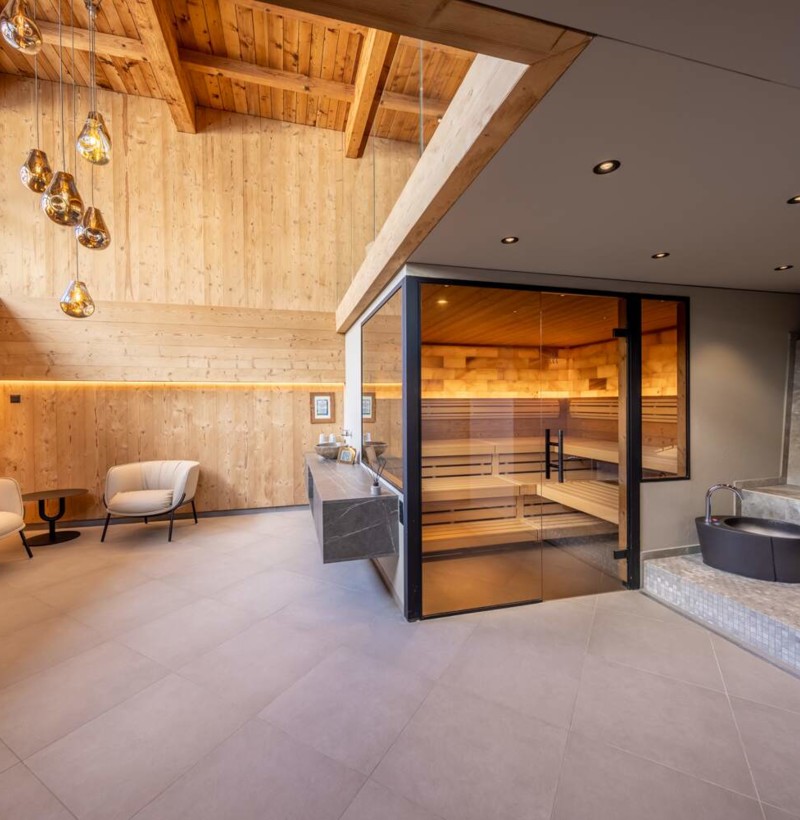 Serene spa lounge with warm wooden accents and sleek furnishings, radiating tranquility ideal for wellness retreats.